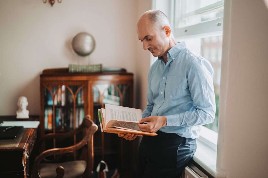 John Tsagaris reviewing published research and clinical literature